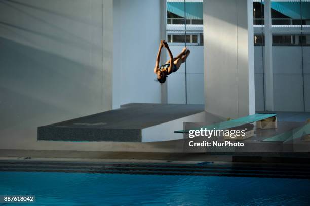 An athlete jumps in Indonesia Open Aquatic Championship at the renovated Aquatics Stadium in Gelora Bung Karno sporting complex, Senayan in Jakarta,...