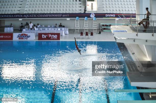 An athlete jumps in Indonesia Open Aquatic Championship at the renovated Aquatics Stadium in Gelora Bung Karno sporting complex, Senayan in Jakarta,...