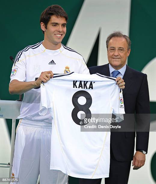 New signing Kaka presents his new Real Madrid shirt beside club President Florentino Perez during his official presentation as a Real Madrid player...