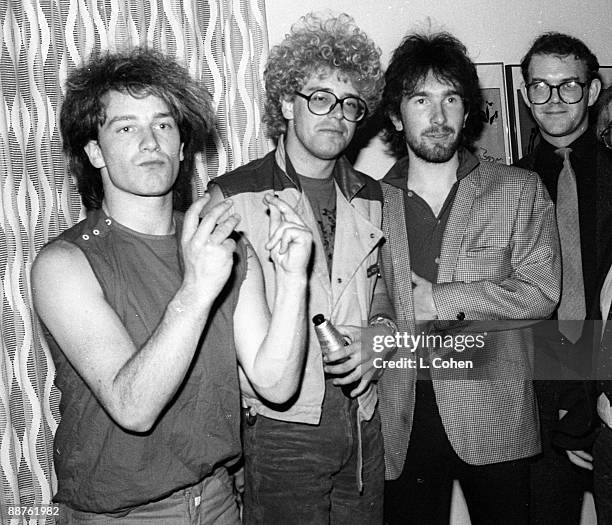 Band members Bono, Adam Clayton and The Edge with band manager Paul McGuinness