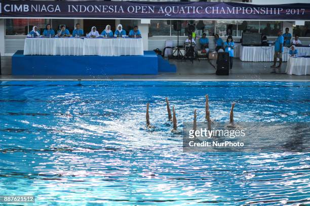 Children perform artistic swim in front of jury in Indonesia Open Aquatic Championship at the renovated Aquatics Stadium in Gelora Bung Karno...