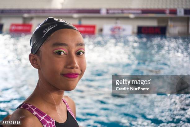 Child posed for camera as she join artistic swim in Indonesia Open Aquatic Championship at the renovated Aquatics Stadium in Gelora Bung Karno...