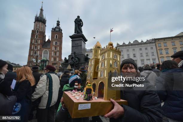 Lady carries a Nativity Scene in Krakow's Main Square, during the 75th Nativity Scene Contest. On Thursday, 7 December 2017, in Krakow, Poland.