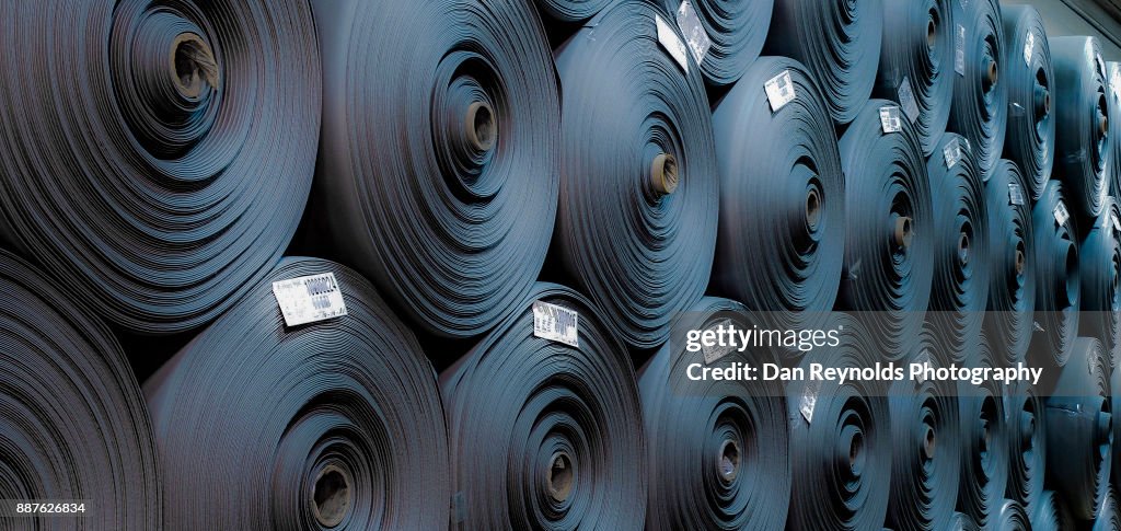 Stacked Carpet Rolls as Abstract