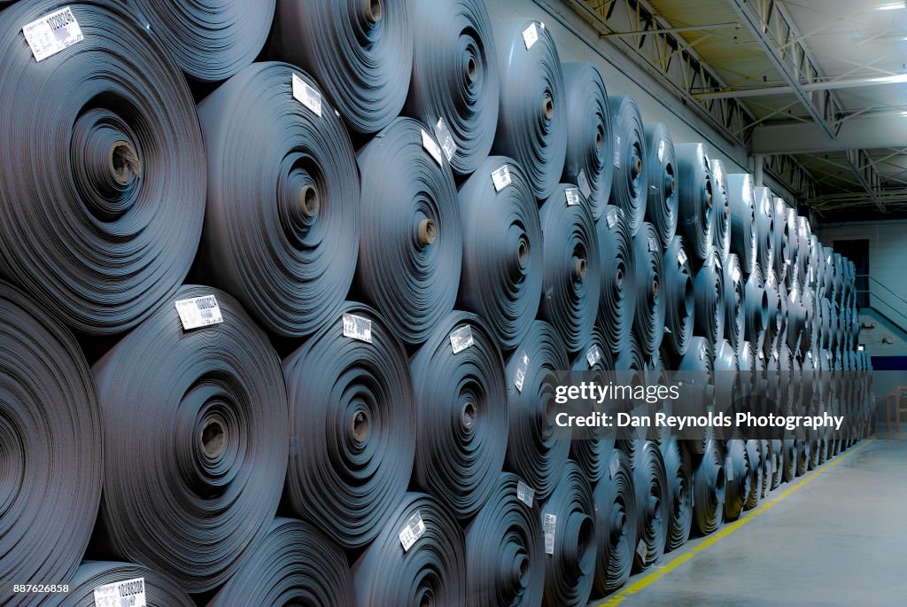 Stacked Carpet Rolls as Abstract