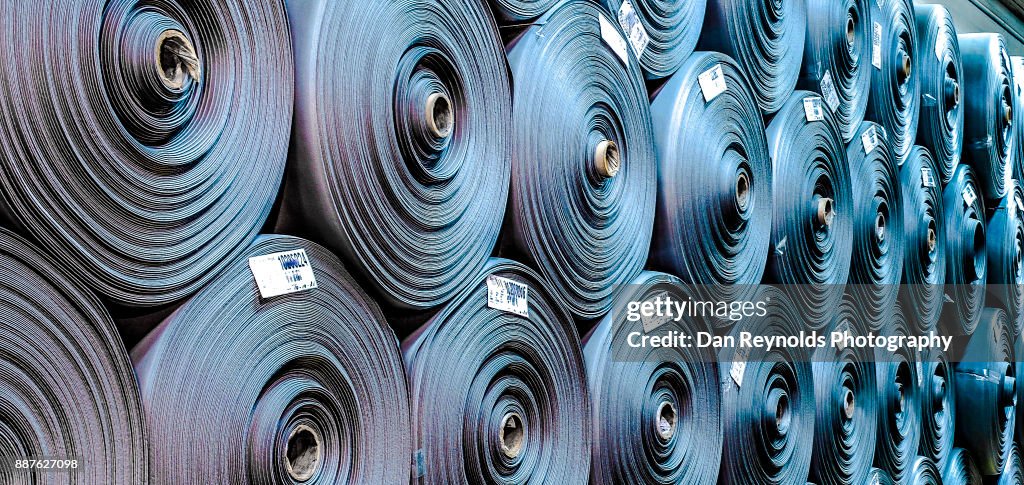 Stacked Carpet Rolls as Abstract