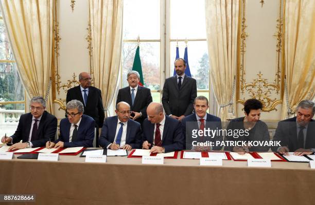 French Prime Minister Edouard Philippe and his Algerian counterpart Ahmed Ouyahia attend a signing ceremony with Schneider Electric Algeria CEO Akli...