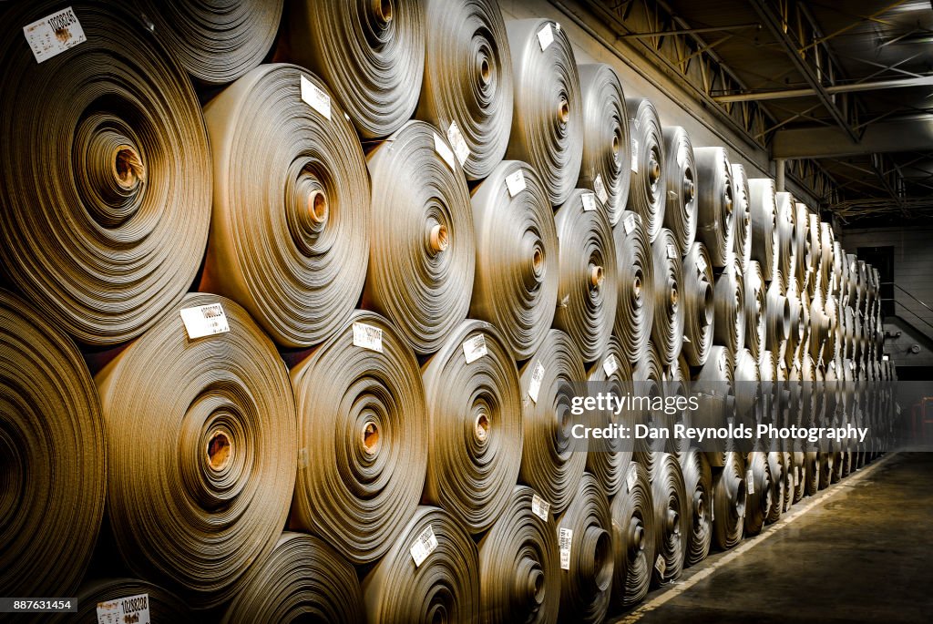 Stacked Carpet Rolls as Abstract