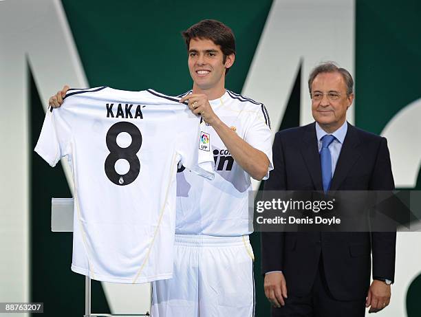 New signing Kaka presents his new Real Madrid shirt beside club President Florentino Perez during his official presentation as a Real Madrid player...