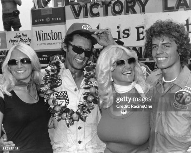 Richard Petty finally rises to the top at the Firecracker 400, after being bridesmaid the last three years. To the right are Miss Hurst Linda Vaughn,...