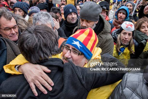 Catalonia's deposed regional president Carles Puigdemont is greeted by supporters during a pro-independence demonstration on December 7, 2017 in...