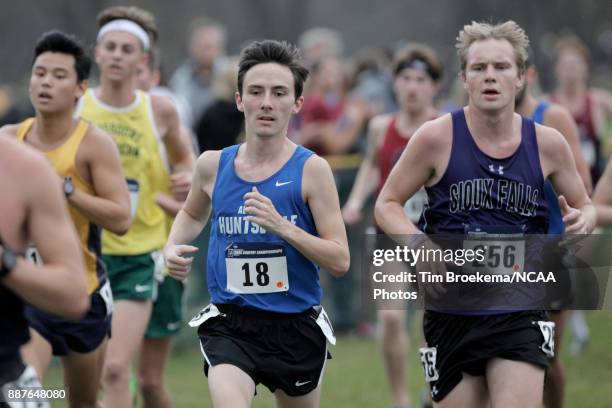 Tripp Maloy of the University of Alabama-Huntsville continues with a pack of runners Division II Men's Cross Country Championship held at the Angel...