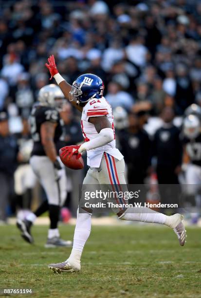 Landon Collins of the New York Giants celebrates after recovering a fumble by Johnny Holton of the Oakland Raiders during their NFL football game at...