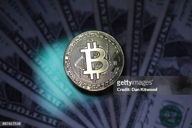 Visual representation of the digital Cryptocurrency, Bitcoin alongside US Dollars on December 07, 2017 in London, England. Cryptocurrencies including...