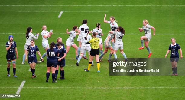 Cambridge University celebrate winning the Womens Varsity Match at the final whistle as Oxford University look dejected after the Womens Varsity...