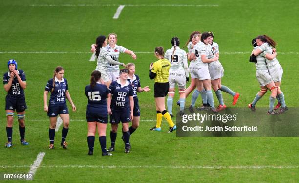 Cambridge University celebrate winning the Womens Varsity Match at the final whistle as Oxford University look dejected after the Womens Varsity...