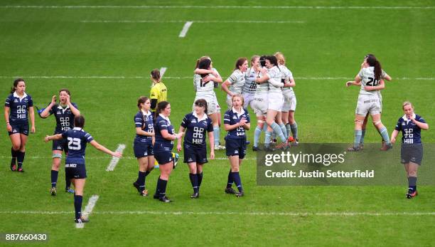 Cambridge University celebrate winning the Womens Varsity Match at the final whistle as Oxford University look dejected after the Womens Varsity...