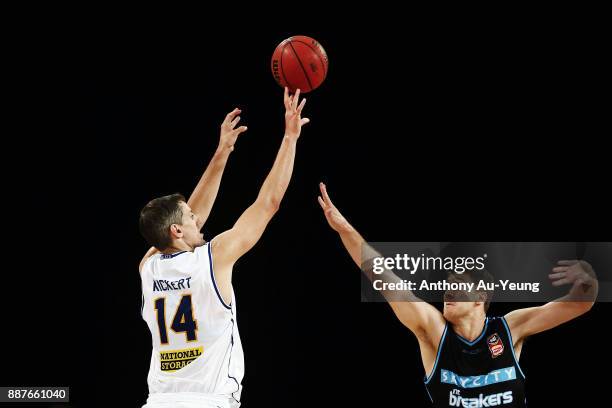 Daniel Kickert of the Bullets shoots against Rob Loe of the Breakers during the round nine NBL match between the New Zealand Breakers and the...