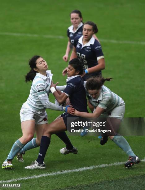 Abby D'Cruz of Oxford is tackled by Sam Chan and Tamsin Banner of Cambridge during the Oxford University vs Cambridge University Womens Varsity match...