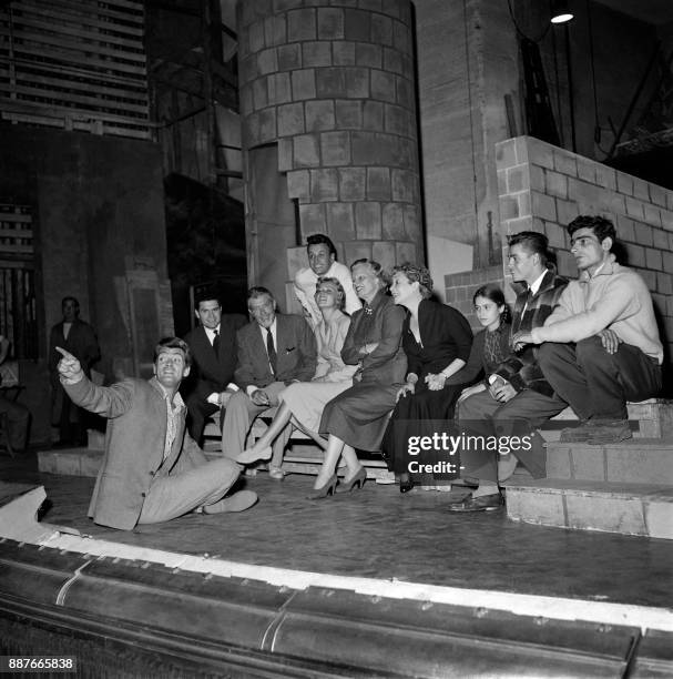 French actors Jeanne Moreau , Elvire Popesco and Charles Denner listen to Jean Marais during a rehearsal of Pygmalion of George Bernard Shaw, in...