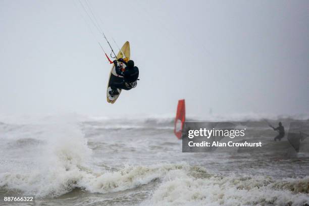 Widsurfers and kitesurfers take advantage of the storm force winds off the coast of West Sussex on December 7, 2017 in Goring, England. Storm...