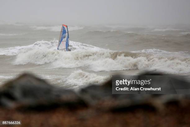 Widsurfers and kitesurfers take advantage of the storm force winds off the coast of West Sussex on December 7, 2017 in Goring, England. Storm...