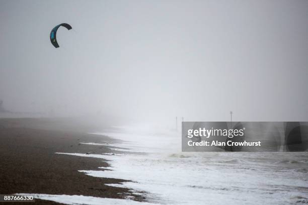 Widsurfers and kitesurfers take advantage of the storm force winds off the coast of West Sussex on December 7, 2017 in Goring, England. Storm...