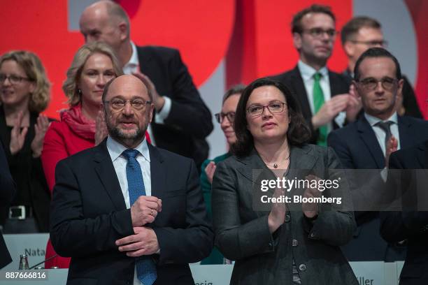 Martin Schulz, leader of the Social Democrat Party , left, looks on as Andrea Nahles, caucus leader of the Social Democrat Party , applauds during...