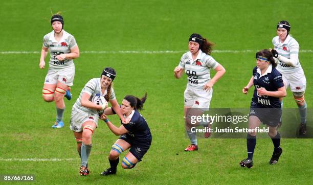 Emily Pratt of Cambridge University is tackled by Caitlin Mcardle of Oxford University during the Womens Varsity Match between Oxford University and...