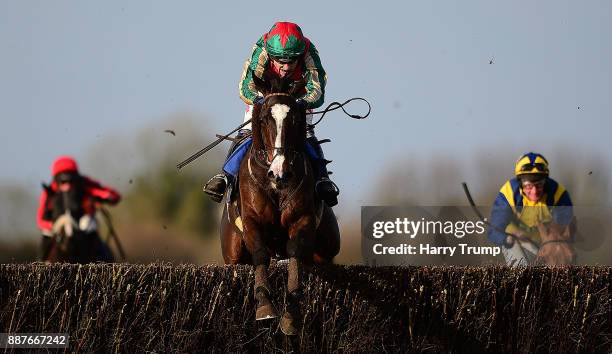 Daklondike ridden by Tom Scudamore jump the last on their way to winning the Weatherbys General Stud Book Online Silver Buck Handicap Chase at...