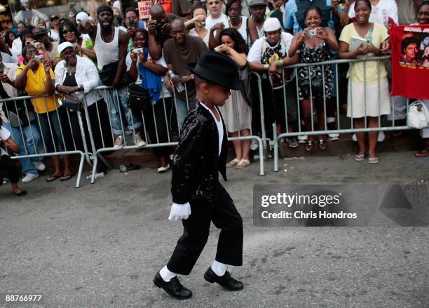 Shemar Williams imitates Michael Jackson's dance the "moonwalk" outside of the Apollo Theater in Harlem, where the deceased pop star first performed...