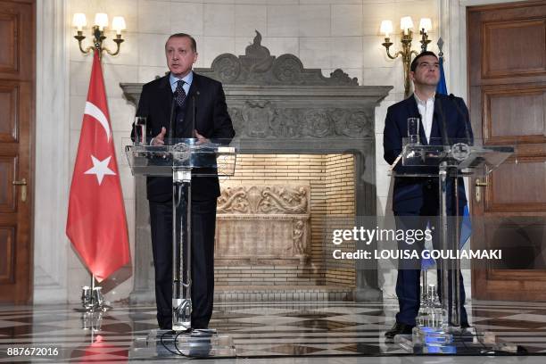 Greek Prime Minister Alexis Tsipras and Turkish President Recep Tayyip Erdogan deliver a joint press conference in Athens on December 7, 2017....