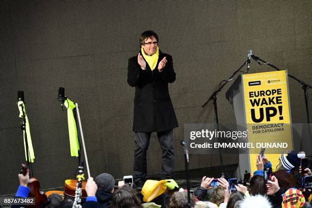 Catalonia's deposed regional president Carles Puigdemont arrives to deliver a speech during a pro-independence demonstration on December 7, 2017 in...
