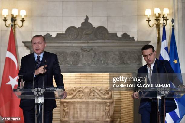 Greek Prime Minister Alexis Tsipras and Turkish President Recep Tayyip Erdogan deliver a joint press conference in Athens on December 7, 2017....