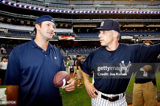 Dallas Cowboys Quarterback and Starter Spokesperson Tony Romo and New York Yankees manager Joe Girardi attend NY Yankee batting practice at Yankee...