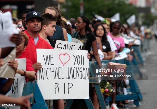 Fans of pop star Michael Jackson wait in line for hours outside the Apollo Theater in Harlem, where the deceased pop star first performed at age 9,...