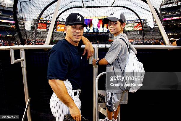 New York Yankees manager Joe Girardi and Ben Grant - 10 year old boy from Starlight Foundation attend NY Yankee batting practice at Yankee Stadium on...