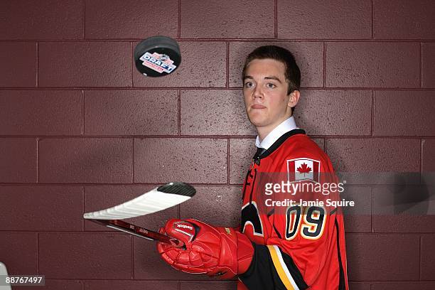 Tim Erixon of the Calgary Flames poses for a photo after he was selected overall by the Flames during the first round of the 2009 NHL Entry Draft at...