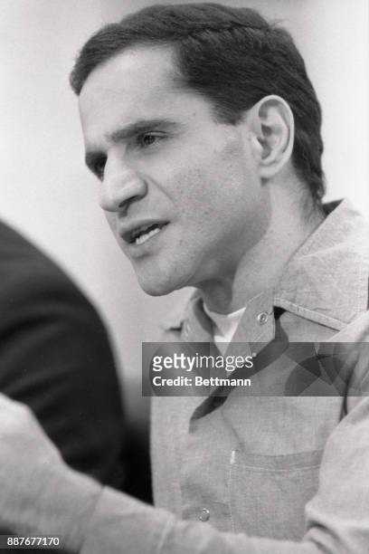 Sirhan Sirhan, killer of Robert F. Kennedy, smiles during his parole hearing.