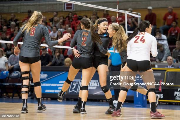 Shelbi Stein of Claremont-Mudd-Scripps is congratulated by her teammates during the Division III Women's Volleyball Championship held at Van Noord...