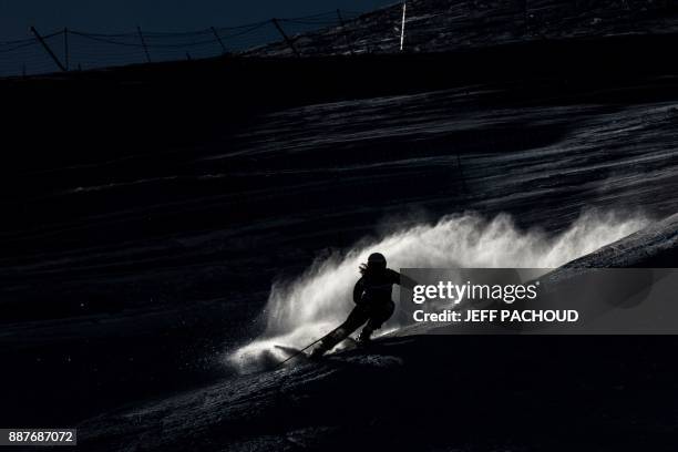 Skier competes in the FIS Women Ski Cross World Cup qualifying session on December 7, 2017 at the Val-Thorens ski resort in the French Alps. / AFP...