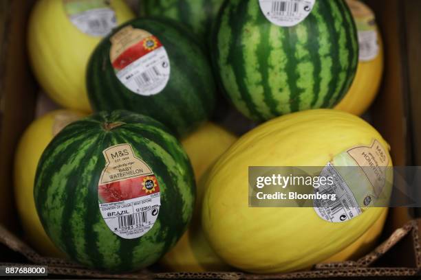 Brazilian honeydew melons and baby watermelons suit on display in the foodhall inside a branch of Marks & Spencer Group Plc in London, U.K., on...