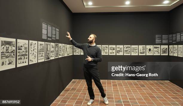 Sergey Harutoonian, curator, explaining the art work of Richard Leue, seen during the 'Lisa Pahlke und Richard Leue - Kopf oder Zahl' Exhibition...