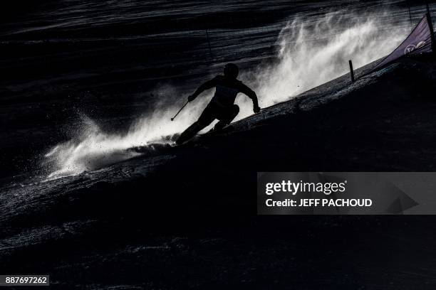 Skier competes during the FIS Women Ski Ccross World Cup qualifying session on December 7, 2017 at the Val-Thorens ski resort in the French Alps. /...