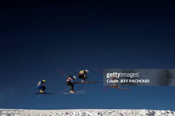 Skiers compete during the FIS Men Ski Cross World Cup qualifying session on December 7, 2017 at the Val-Thorens ski resort in the French Alps. / AFP...