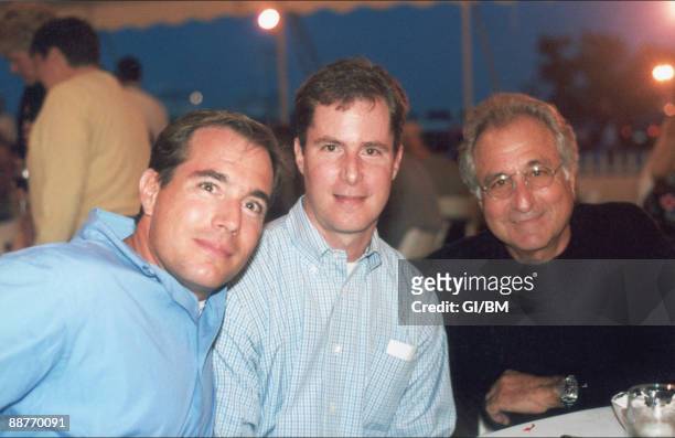 Financier Bernard Madoff with his sons Mark Madoff and Andrew Madoff during July 2001 in Montauk, NY.