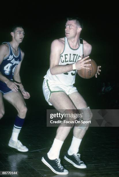 S: Tom Heinsohn of the Boston Celtics is guarded by Jerry West of the Los Angeles Lakers during a mid circa 1960's NBA basketball game at the Boston...