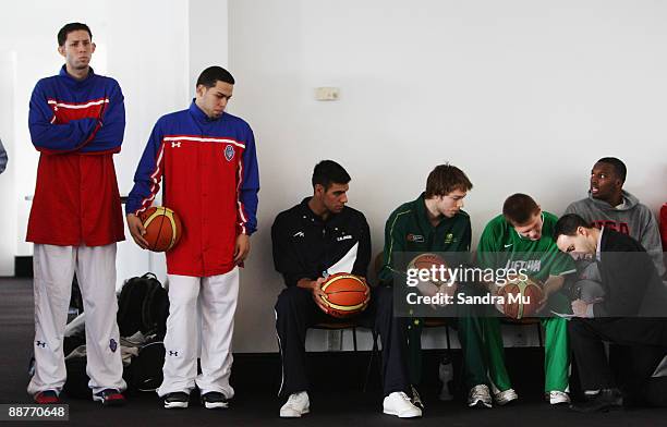 Carlos Lopez and Raymond Cintron of Puerto Rico with Matthew Dellavedova of Australia, Matas Sapiega of Lithuania and Shelvin Mack of USA wait for...