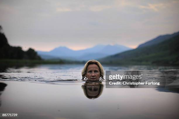 Lady Alice Douglas swims in Llyn Mymbyr in the shadow of the Snowdon Horseshoe in North Wales on June 30, 2009 in Capel Curig, United Kingdom. Lady...