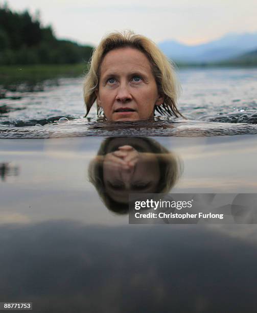 Lady Alice Douglas swims in Llyn Mymbyr in the shadow of the Snowdon Horseshoe in North Wales on June 30, 2009 in Capel Curig, United Kingdom. Lady...